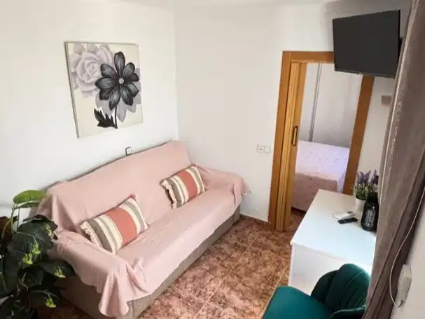 Sala d'estar de Casa adosada en venda en Algarrobo amb Aire condicionat, Terrassa i Balcó