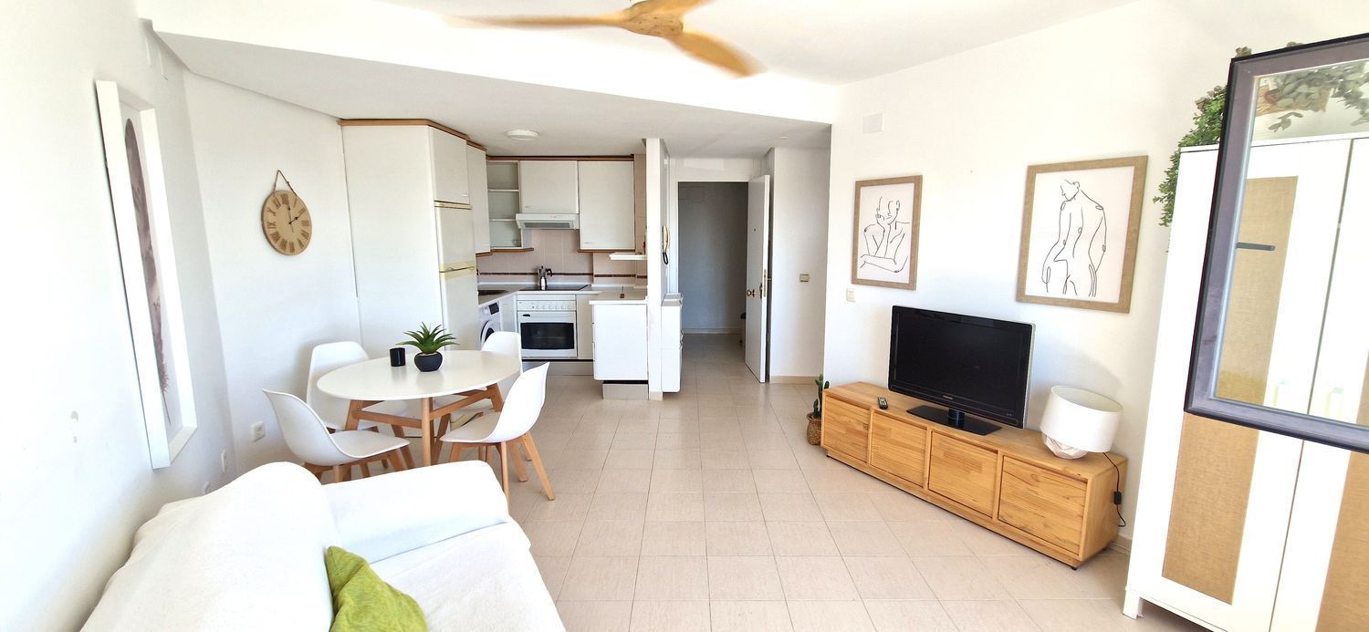 Sala de estar de Piso de alquiler en El Rompido con Amueblado y Piscina comunitaria