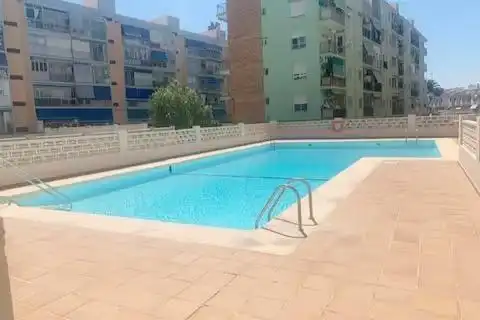 Piscina de Apartament de lloguer en La Pobla de Farnals amb Aire condicionat, Terrassa i Moblat