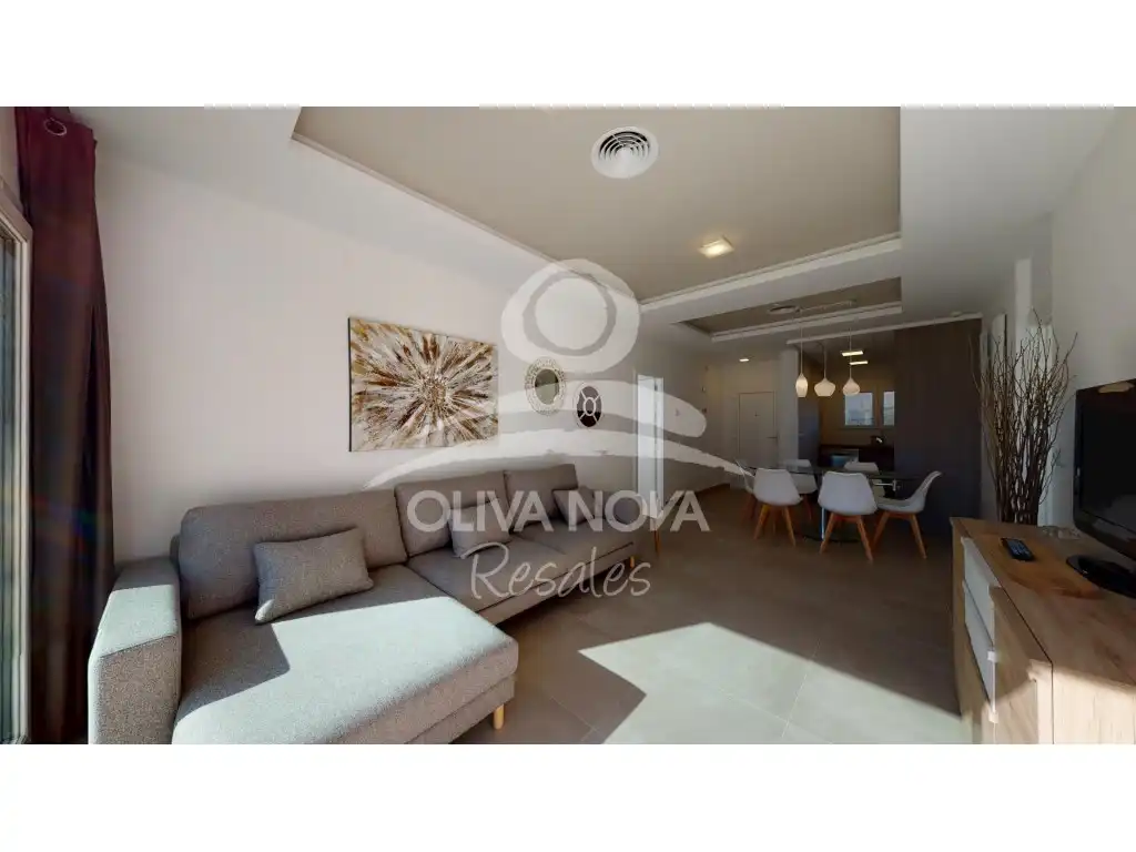 Sala d'estar de Apartament en venda en Oliva amb Aire condicionat, Jardí privat i Piscina
