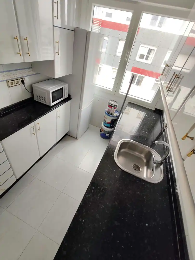Kitchen of Flat for share in Os Mallos