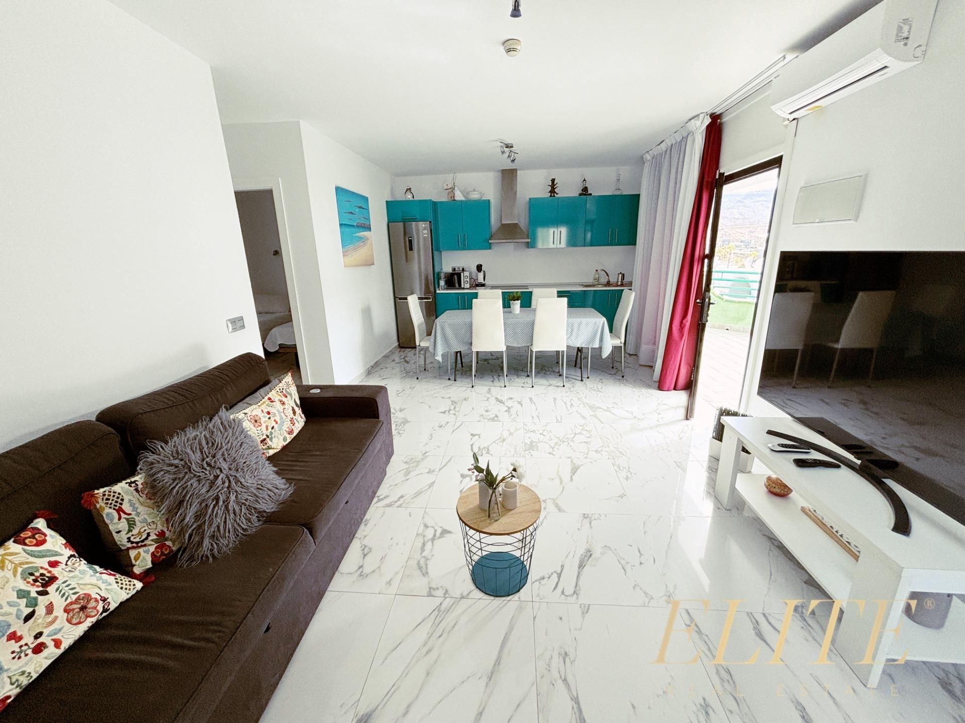 Sala d'estar de Apartament en venda en Mogán amb Aire condicionat, Jardí privat i Terrassa