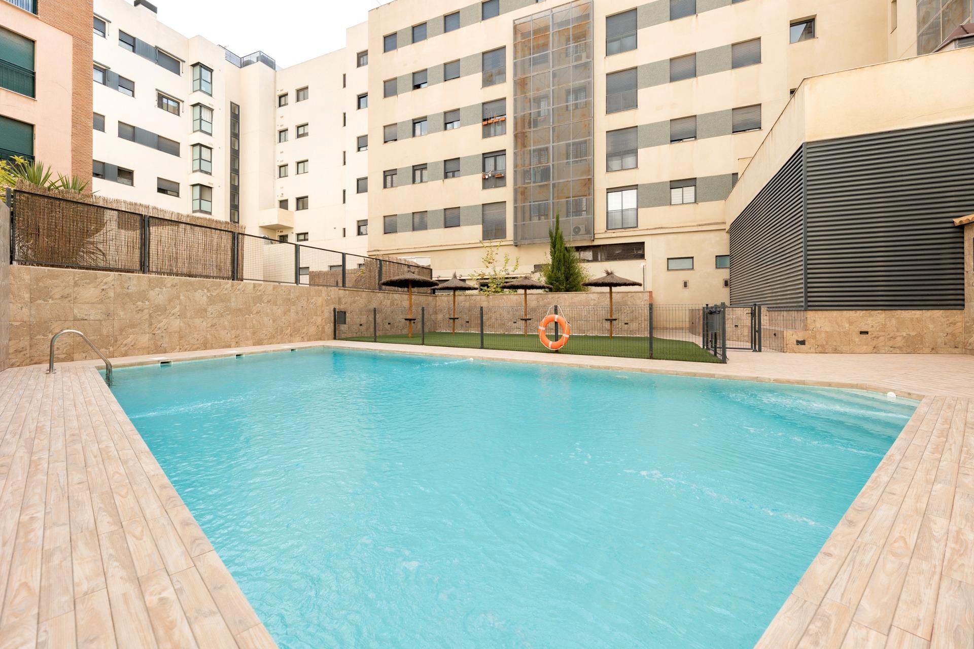 Swimming pool of Flat for sale in  Granada Capital  with Air Conditioner, Heating and Parquet flooring