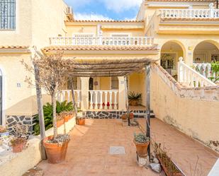 Vista exterior de Casa adosada en venda en Santa Pola amb Piscina