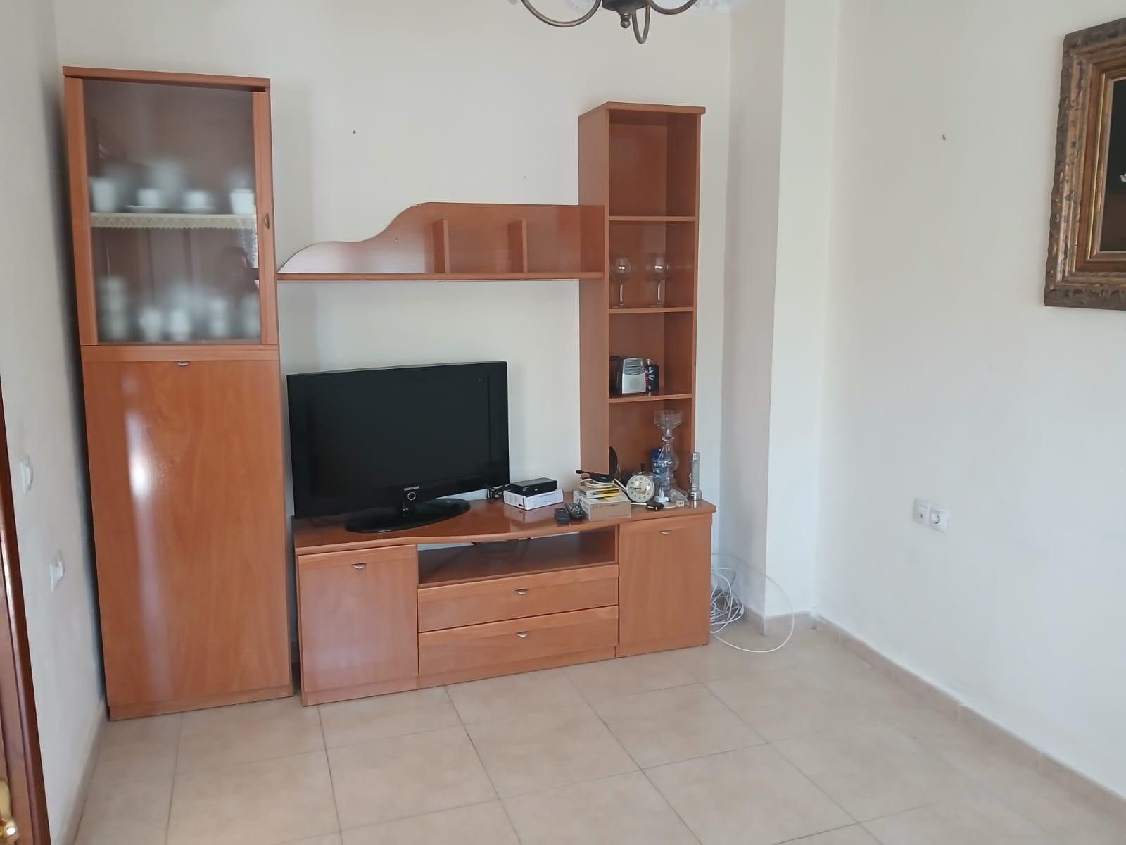 Sala de estar de Casa adosada en venta en  Huelva Capital con Aire acondicionado