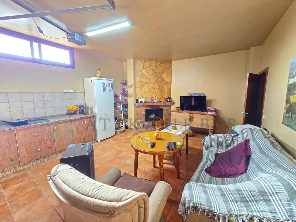 Sala d'estar de Casa adosada en venda en Colmenar amb Aire condicionat, Terrassa i Piscina