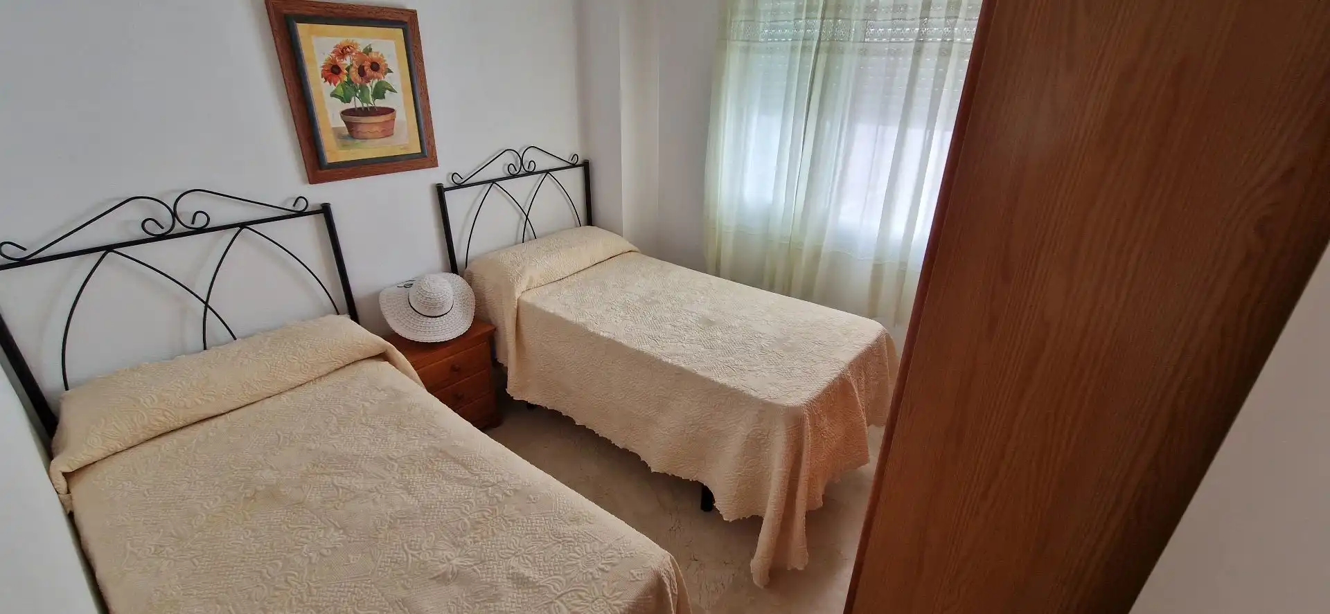 Dormitori de Apartament de lloguer en El Portil amb Moblat i Piscina comunitària