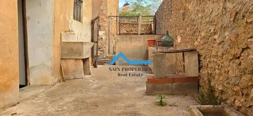 Casa rústica amb terrassa en venda a Pueblo - Urbanizaciones