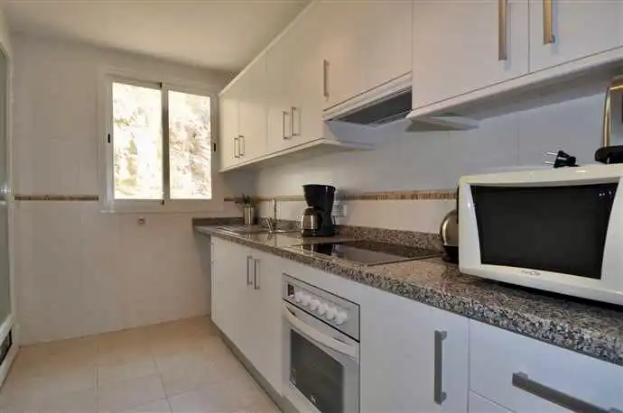 Cuina de Apartament en venda en Calpe / Calp amb Aire condicionat, Calefacció i Jardí privat