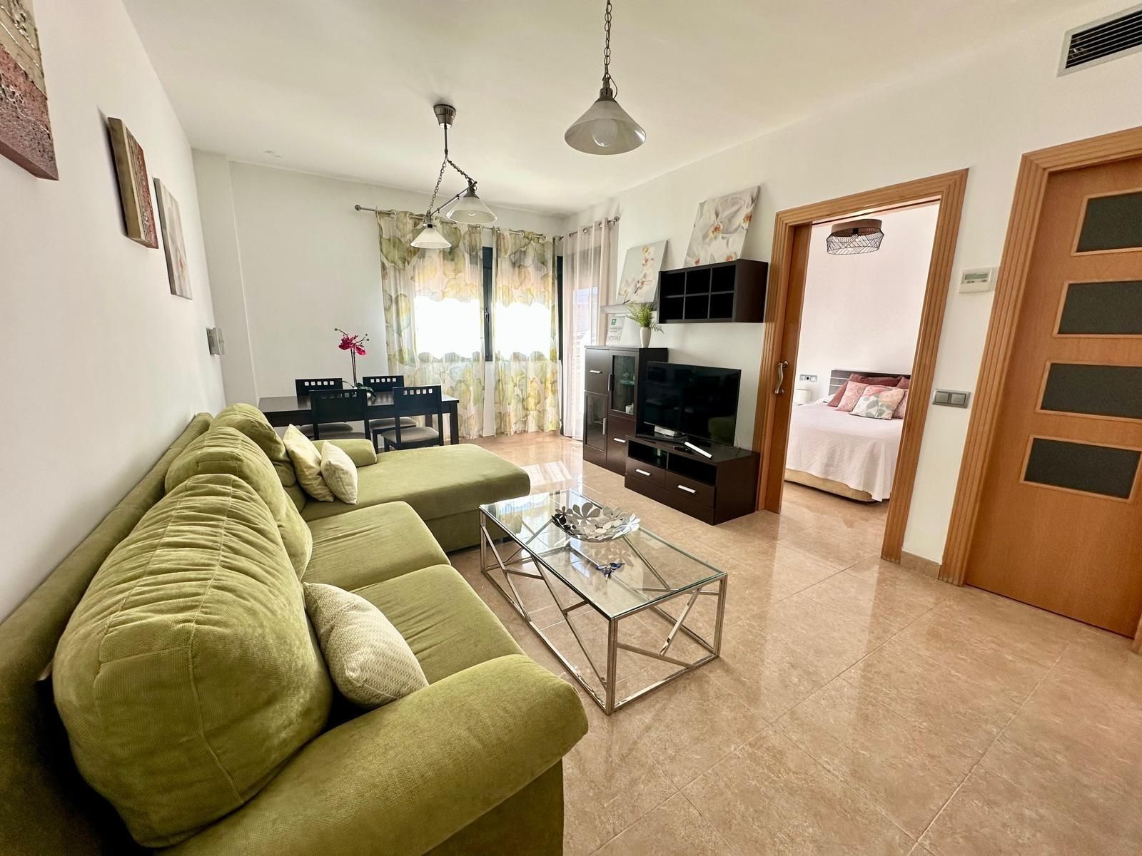 Living room of Flat for sale in Roquetas de Mar  with Air Conditioner, Private garden and Terrace