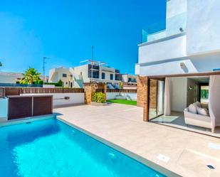 Swimming pool of Single-family semi-detached for sale in Benijófar  with Air Conditioner, Private garden and Terrace
