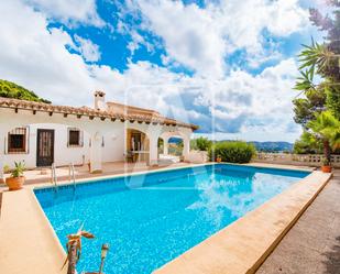 Vista exterior de Casa o xalet en venda en Moraira amb Jardí privat, Terrassa i Traster