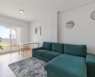 Sala d'estar de Apartament en venda en Torrevieja amb Aire condicionat, Jardí privat i Moblat