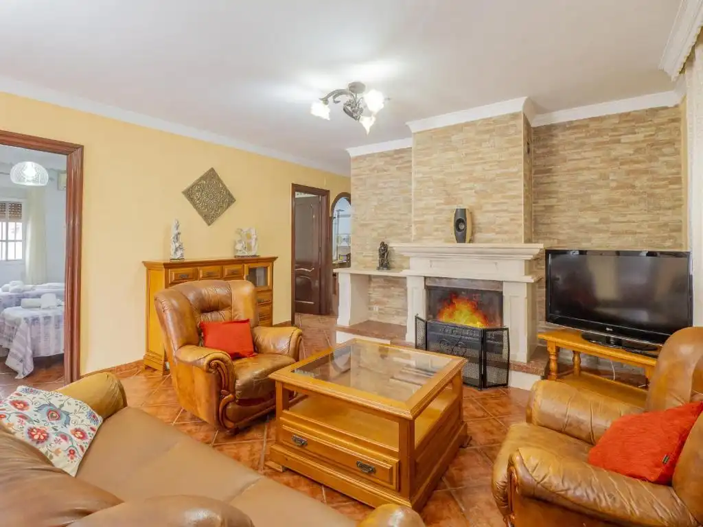 Sala d'estar de Casa o xalet en venda en Málaga amb Jardí privat, Terrassa i Piscina