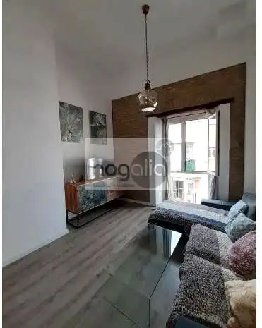 Sala d'estar de Dúplex de lloguer en Sevilla amb Aire condicionat, Terrassa i Moblat