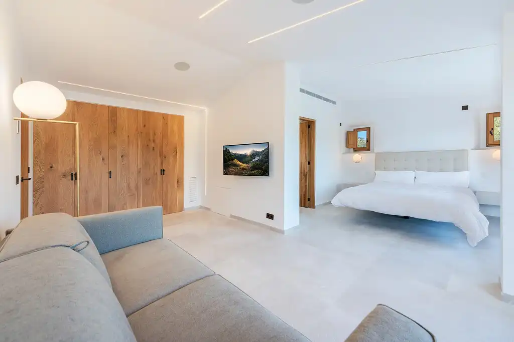 Sala de estar de Finca rústica en venta en Pollença con Aire acondicionado, Calefacción y Jardín privado