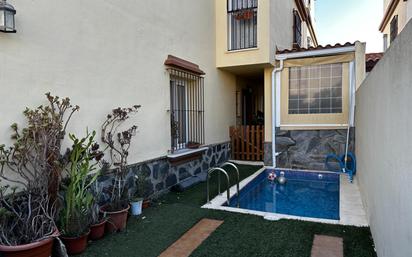 Swimming pool of Single-family semi-detached for sale in Alcalá del Río  with Air Conditioner and Swimming Pool