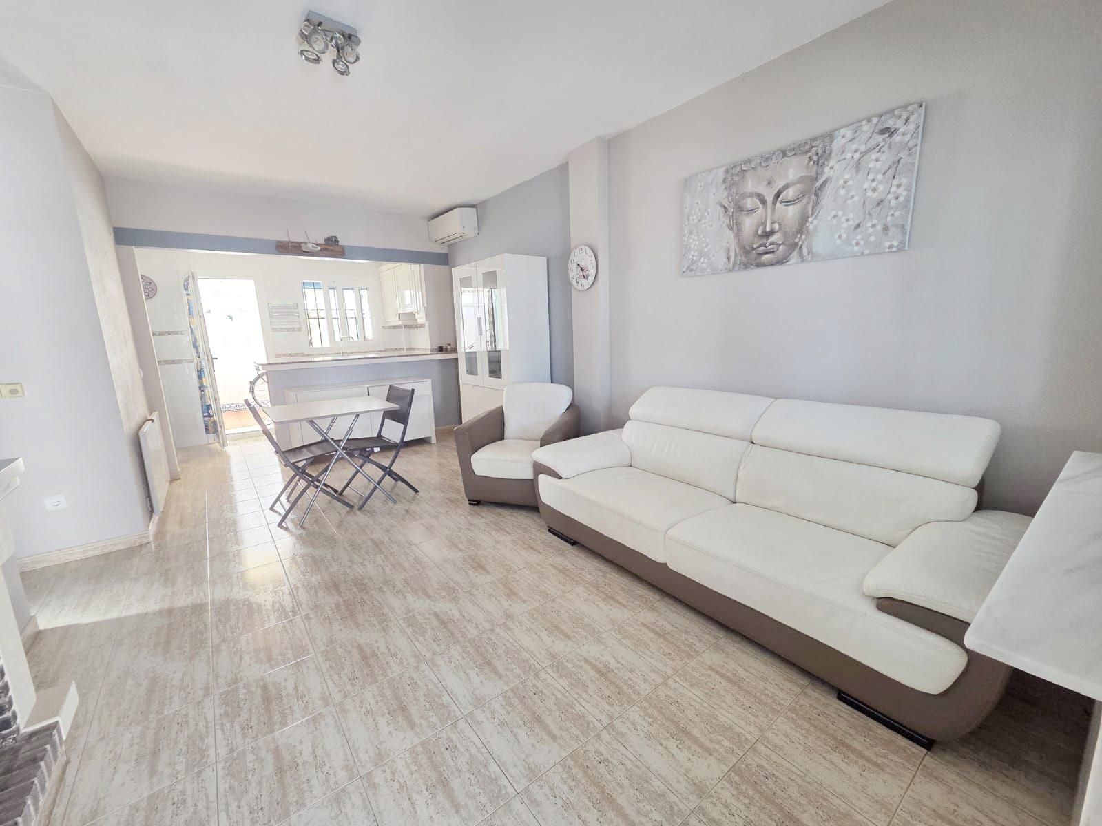 Sala d'estar de Casa adosada en venda en El Verger amb Aire condicionat, Jardí privat i Terrassa