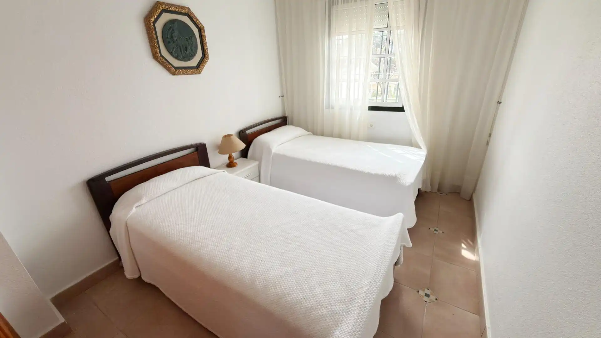 Habitación de Casa adosada de alquiler en Punta Umbría con Terraza y Piscina comunitaria