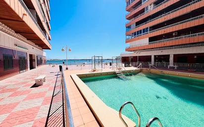Swimming pool of Flat for sale in Torrevieja  with Air Conditioner, Heating and Furnished