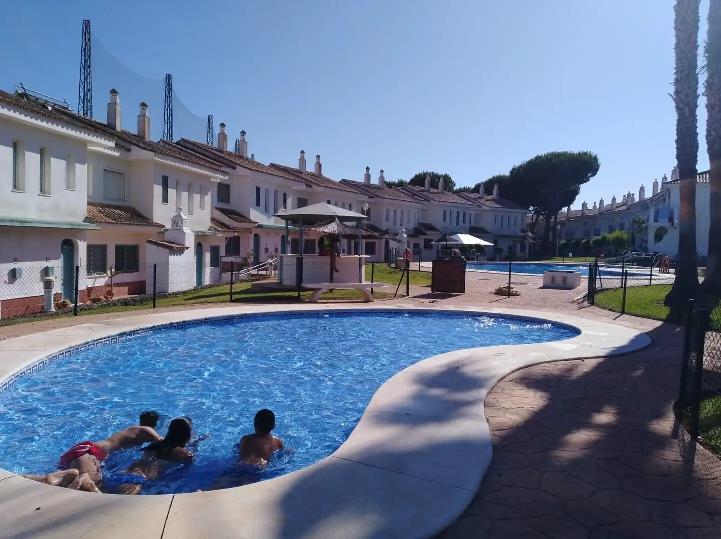Piscina de Casa adosada en venta en El Portil con Calefacción, Terraza y Amueblado