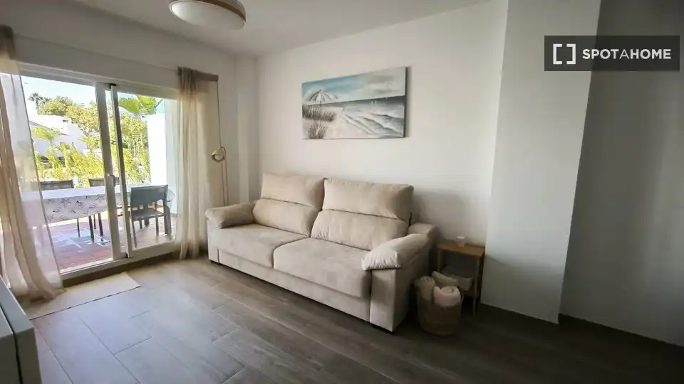 Sala de estar de Apartamento para compartir en Chipiona con Aire acondicionado, Terraza y Amueblado