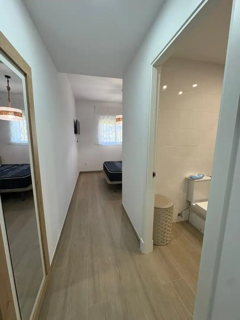Schlafzimmer von Wohnung zum Verkauf in Chipiona mit Klimaanlage, Heizung und Privatgarten