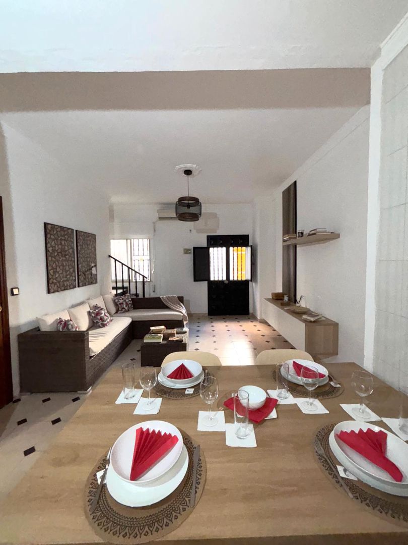Sala d'estar de Casa adosada en venda en Málaga Capital amb Aire condicionat, Terrassa i Moblat