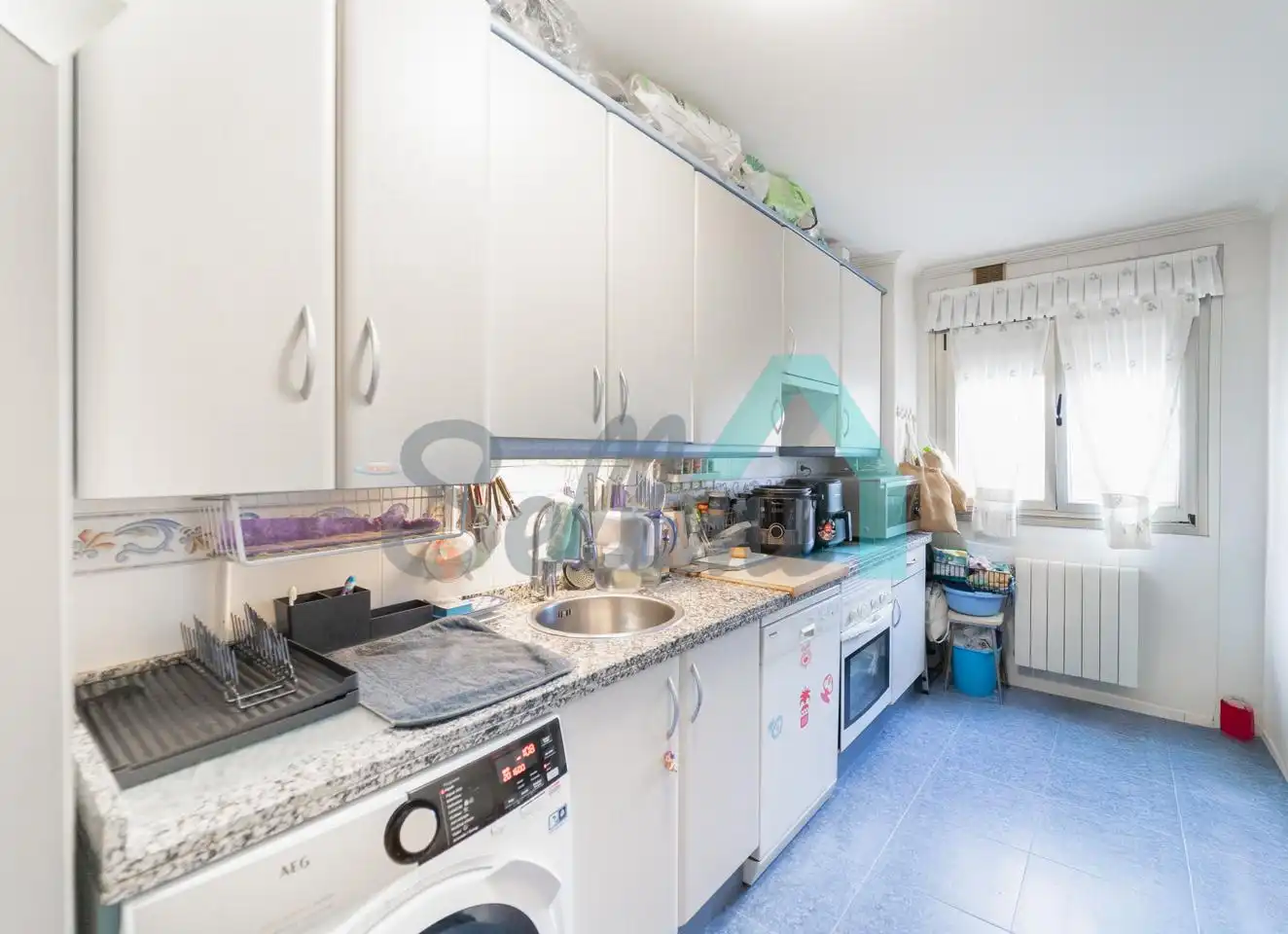 Kitchen of Flat for sale in Oviedo   with Heating, Parquet flooring and Storage room