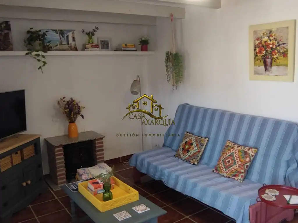 Sala d'estar de Finca rústica de lloguer en Benamargosa amb Moblat