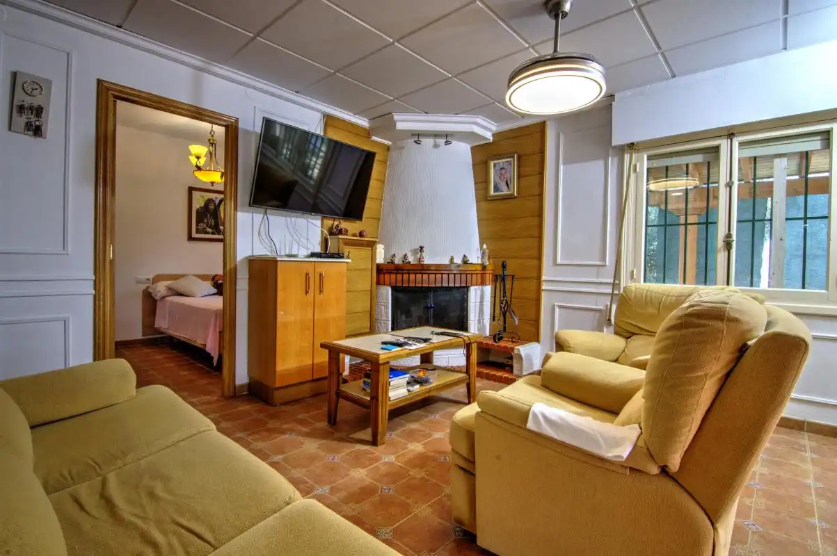 Sala d'estar de Casa o xalet en venda en Alicante / Alacant amb Aire condicionat, Calefacció i Jardí privat