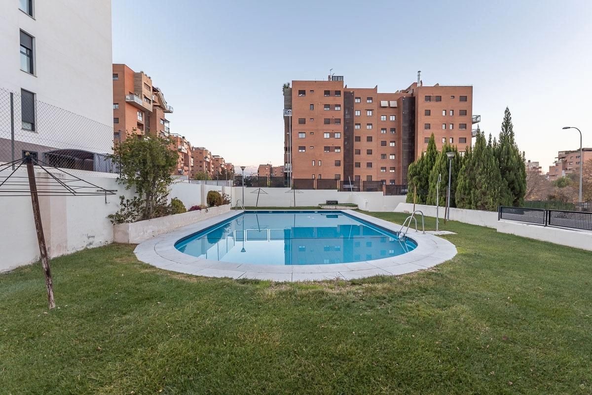 Swimming pool of Flat for sale in  Granada Capital  with Heating, Terrace and Storage room