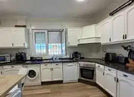 Cuina de Casa o xalet en venda en Punta Umbría amb Aire condicionat, Jardí privat i Parquet