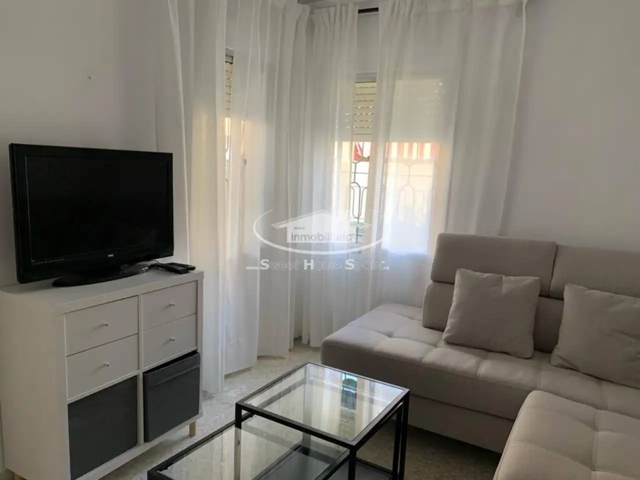Sala d'estar de Casa adosada en venda en Sanlúcar de Barrameda amb Aire condicionat, Terrassa i Moblat