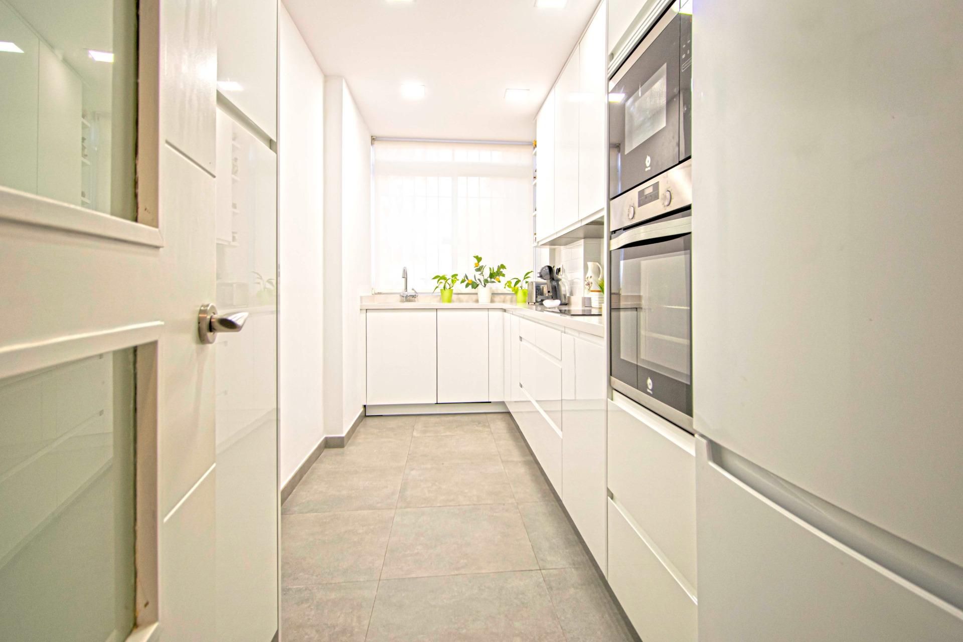 Kitchen of Flat for sale in  Sevilla Capital  with Air Conditioner and Private garden