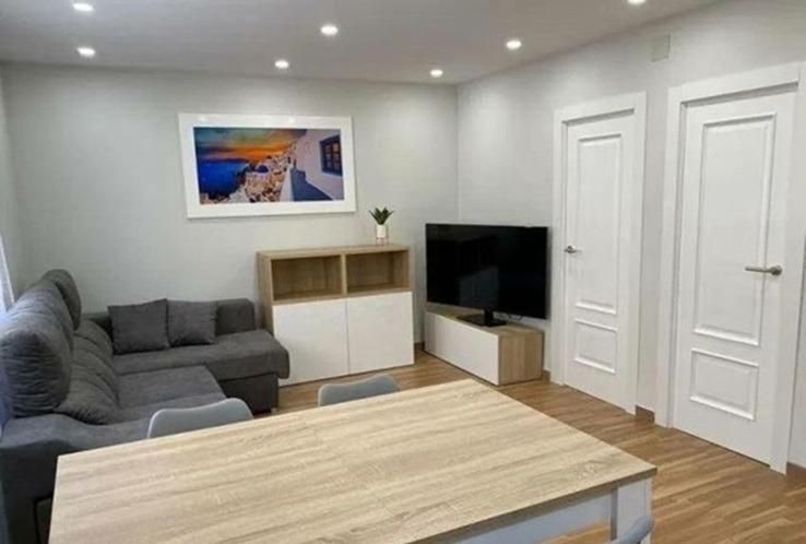 Sala d'estar de Pis de lloguer en Cambrils amb Aire condicionat, Calefacció i Jardí privat
