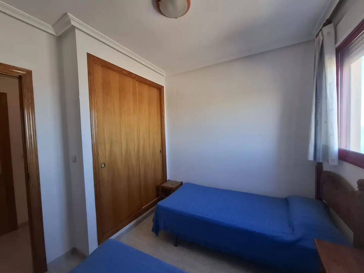 Dormitori de Pis de lloguer en Villajoyosa / La Vila Joiosa amb Aire condicionat, Terrassa i Piscina comunitària