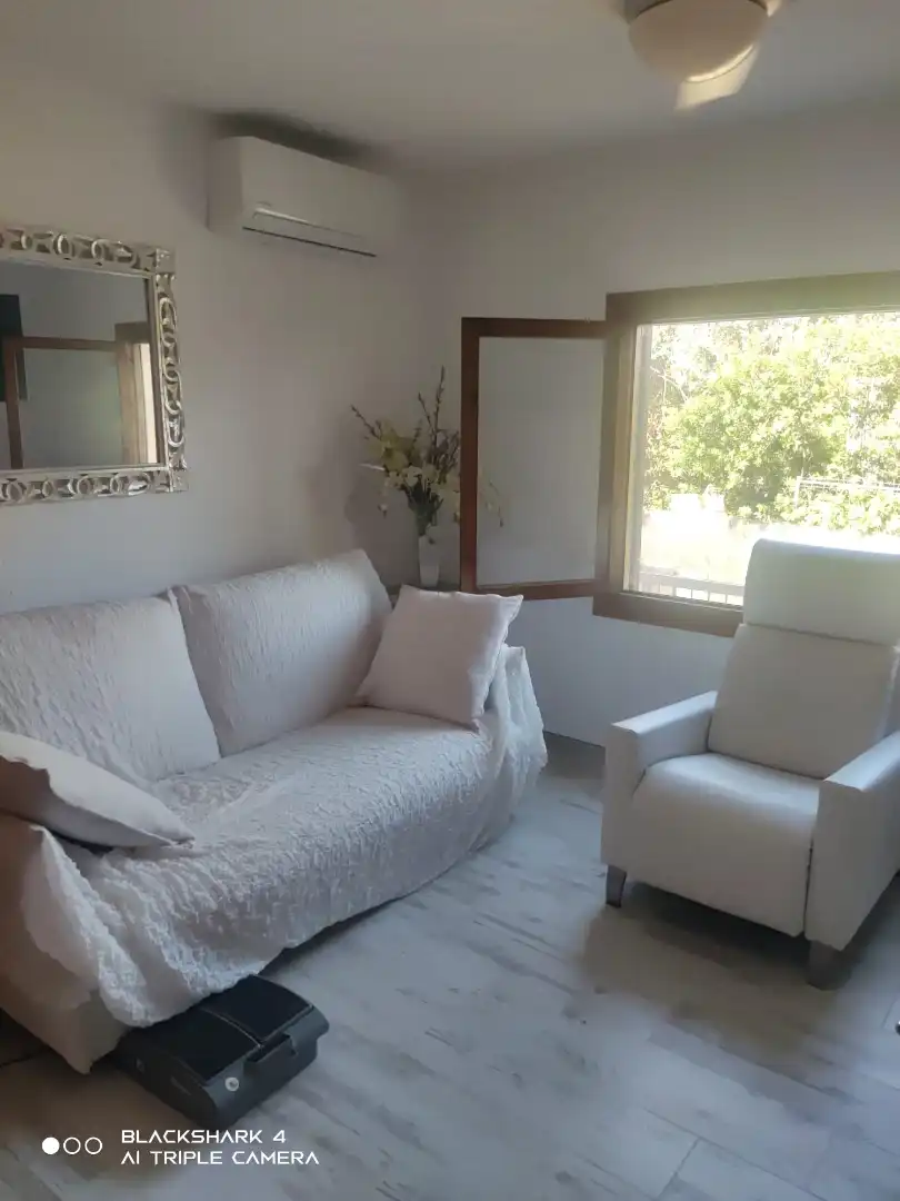 Sala d'estar de Casa o xalet en venda en Alcalà de Xivert amb Aire condicionat, Jardí privat i Terrassa