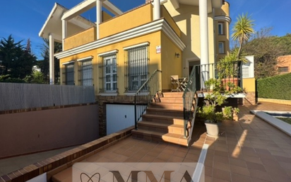 Exterior view of Single-family semi-detached for sale in Aljaraque  with Air Conditioner, Terrace and Swimming Pool