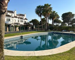 Piscina de Casa adosada de lloguer en El Portil amb Aire condicionat, Terrassa i Balcó