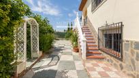 Exterior view of House or chalet for sale in Cúllar Vega  with Heating, Storage room and Swimming Pool