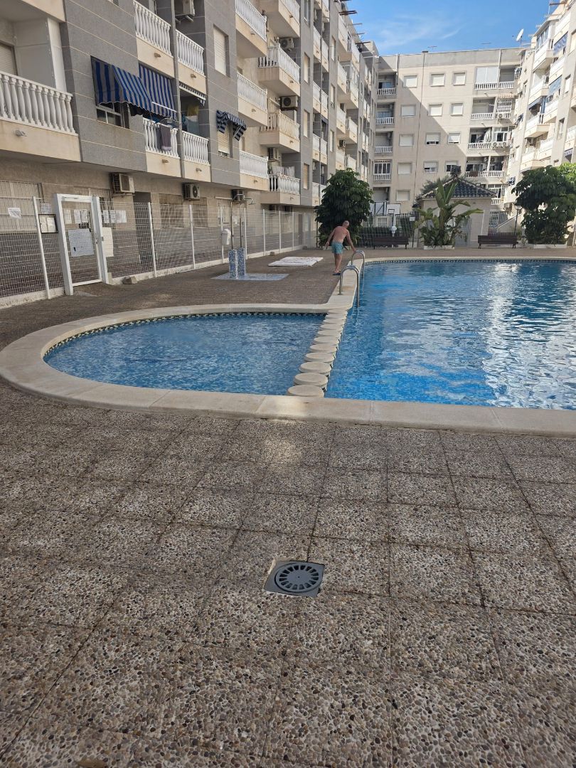 Swimming pool of Apartment for sale in Torrevieja  with Air Conditioner, Heating and Furnished