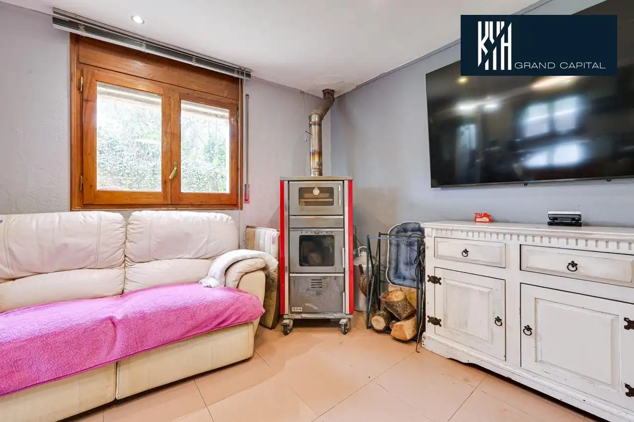 Sala de estar de Casa adosada en venta en Juià