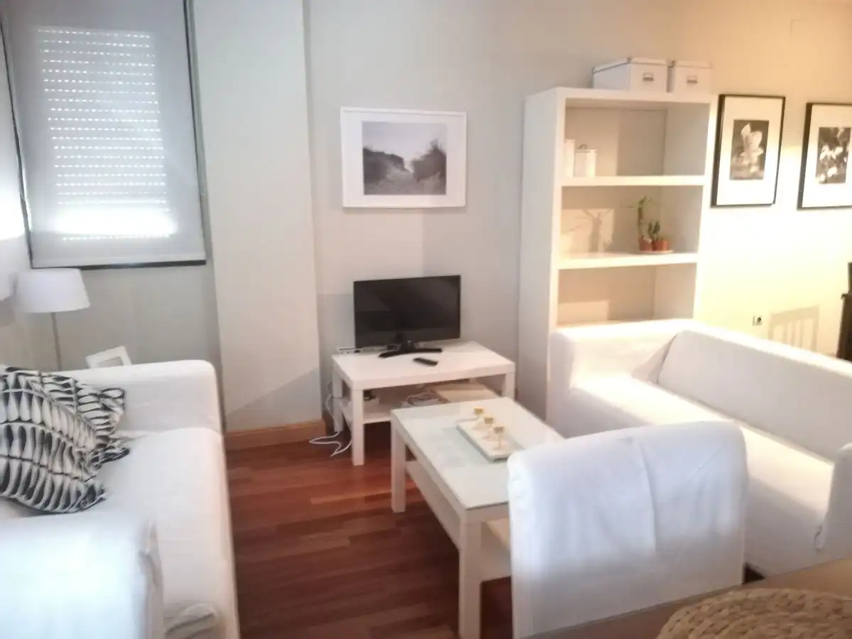 Sala d'estar de Pis de lloguer en Huelva amb Aire condicionat, Moblat i Piscina comunitària