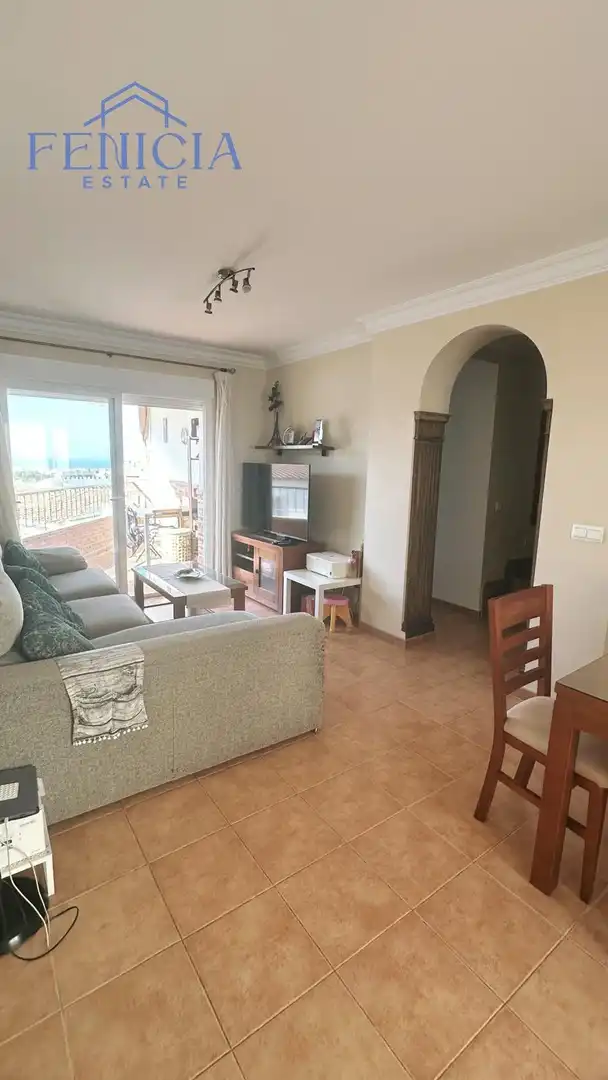 Sala de estar de Casa adosada en venta en Nerja con Jardín privado, Terraza y Piscina comunitaria