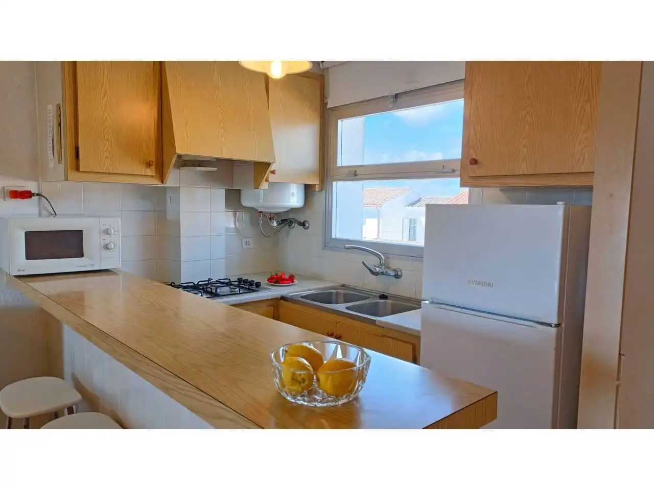 Cocina de Piso en venta en L'Escala con Terraza, Amueblado y Piscina comunitaria