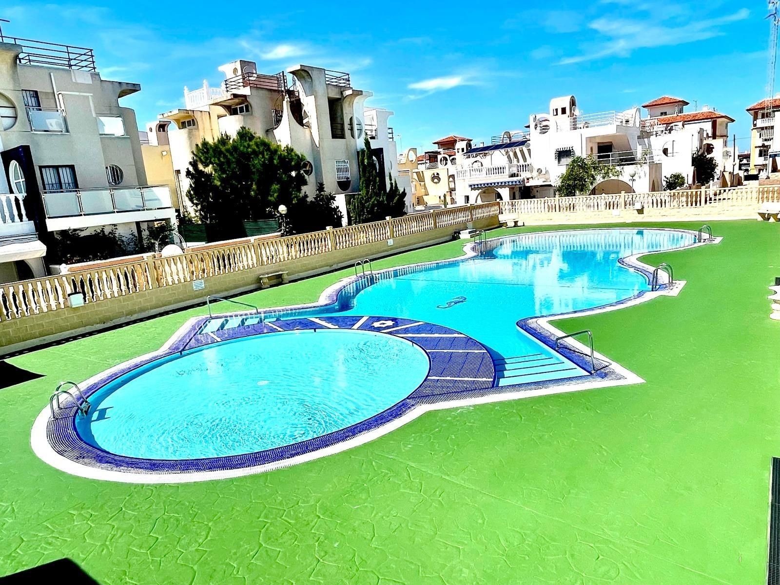 Swimming pool of Flat for sale in Torrevieja  with Air Conditioner, Heating and Private garden
