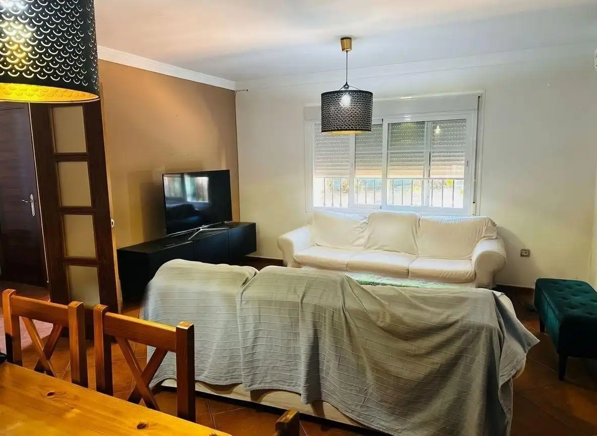 Sala de estar de Casa adosada en venta en Campo de Mijas