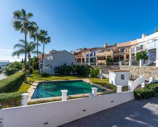 Exterior view of Single-family semi-detached for sale in Estepona  with Air Conditioner, Terrace and Swimming Pool