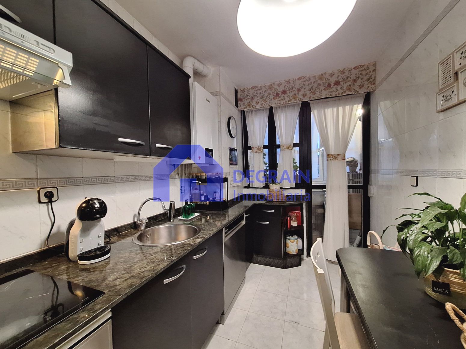 Kitchen of Attic for sale in Oviedo   with Heating, Parquet flooring and Storage room